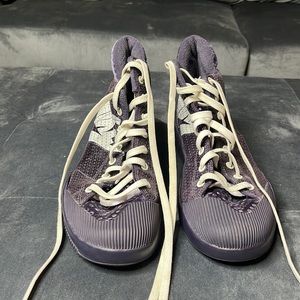 Nike tennis shoes with purple sparkle on the back